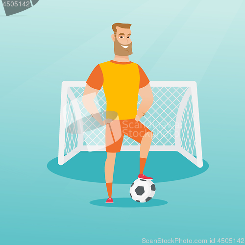 Image of Young caucasian football player with a ball.