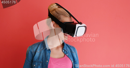 Image of young girl using VR headset glasses of virtual reality