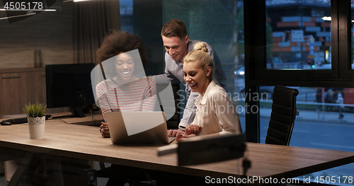 Image of Multiethnic startup business team in night office