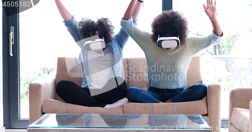 Image of Multiethnic Couple using virtual reality headset