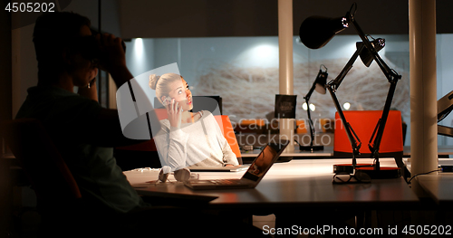 Image of young designers in the night office