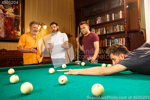 Image of Close-up shot of a man playing billiard