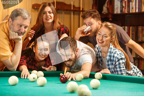 Image of Close-up shot of a man playing billiard