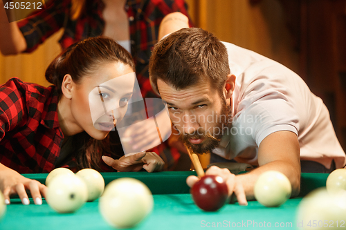 Image of Close-up shot of a man playing billiard