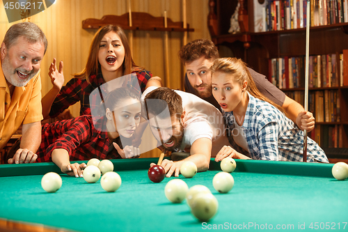 Image of Close-up shot of a man playing billiard