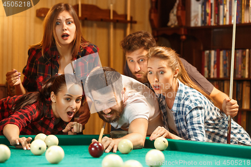 Image of Close-up shot of a man playing billiard