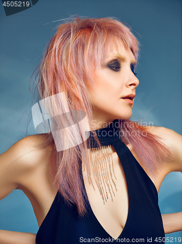 Image of Close-up indoor portrait of lovely girl with blonde hair. Studio