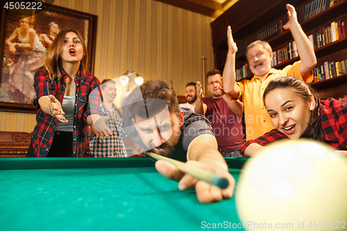 Image of Close-up shot of a man playing billiard