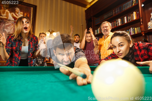 Image of Close-up shot of a man playing billiard