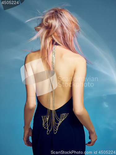 Image of Close-up indoor portrait of lovely girl with blonde hair. Studio