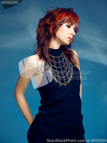 Image of Close-up indoor portrait of lovely girl with colorful hair. Studio shot of graceful young woman with short haircut