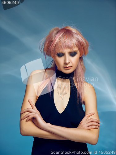 Image of Close-up indoor portrait of lovely girl with blonde hair. Studio shot of graceful young woman with short haircut