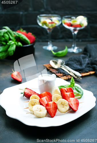 Image of banana with strawberry