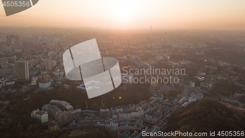 Image of Skyline bird eye aerial view of the city center with an art college and a television tower under dramatic sunset sky in Kiev, Ukraine