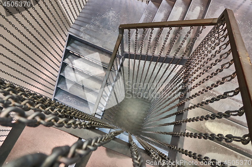 Image of The staircase with a view from the top down is the building