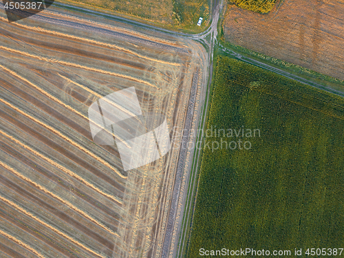 Image of View from the height of a bird\'s flight from flying drones to agricultural fields, prepared for sowing crops.