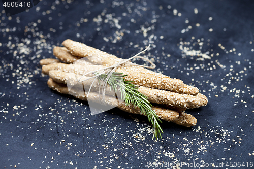 Image of Italian grissini or salted bread sticks with sesame and rosemary