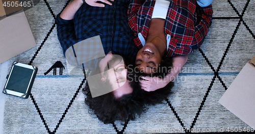 Image of Top view of attractive young multiethnic couple