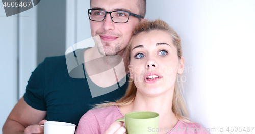 Image of young couple enjoying morning coffee