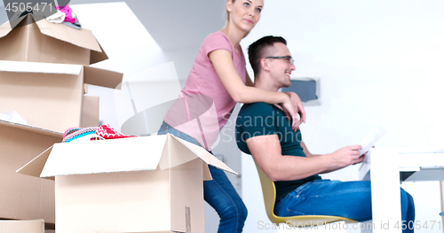 Image of Young couple moving in a new home