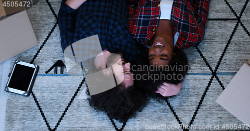 Image of Top view of attractive young multiethnic couple