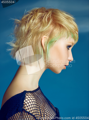 Image of Close-up indoor portrait of lovely girl with blonde hair. Studio