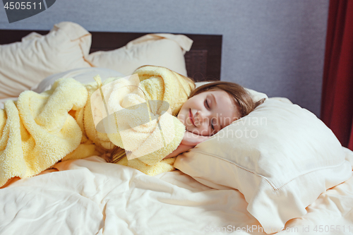 Image of The child little girl sleeping in the bed