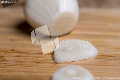 Image of Closeup of a sliced garlic glove