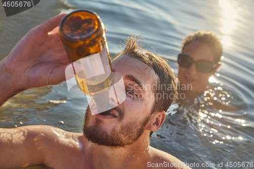 Image of Summer beach fun drinking beer