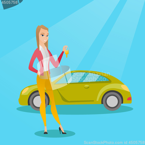 Image of Woman holding keys to her new car.