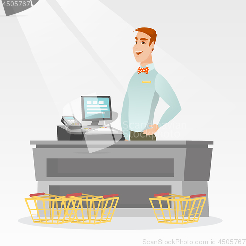 Image of Cashier standing at the checkout in a supermarket.