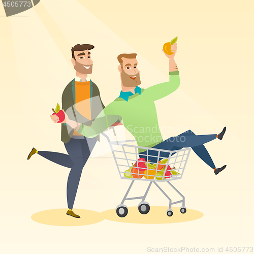 Image of Couple of friends riding in shopping trolley.