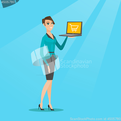 Image of Woman holding laptop with trolley on a screen.