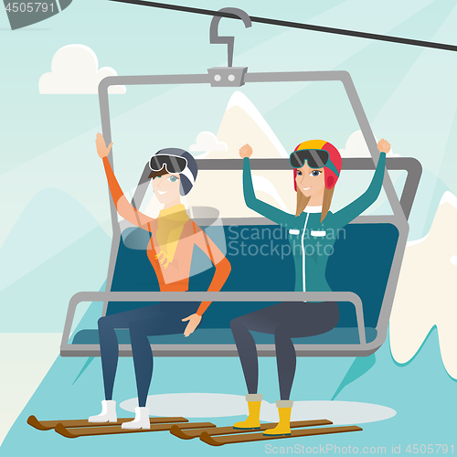 Image of Two caucasian skiers using cableway at ski resort.