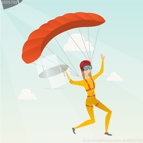 Image of Young caucasian skydiver flying with a parachute.