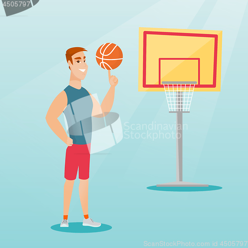 Image of Young caucasian basketball player spinning a ball.