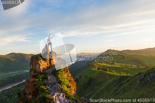 Image of Woman on top mountain in Altai