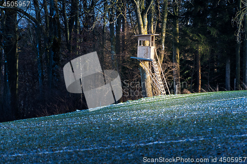 Image of Deerstand with field and forest in Bavaria, Germany in winter