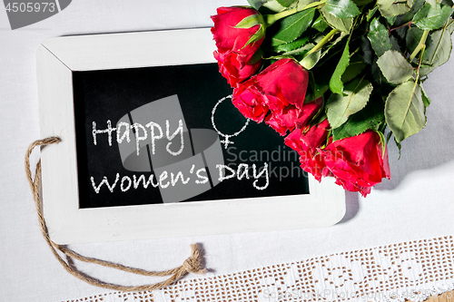 Image of Image of a slate blackboard with chalk message Happy Women\'s Day