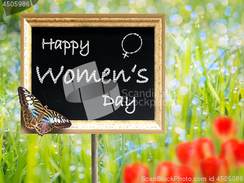 Image of Black chalkboard with text Happy women\'s day