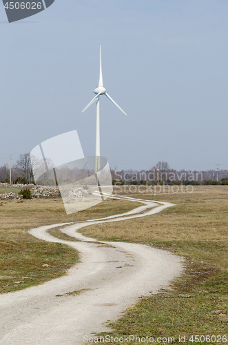 Image of Windmill by a winding country road