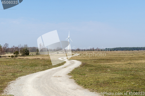 Image of Winding country road leading to a windmill