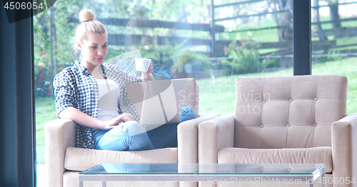 Image of woman drinking coffee enjoying relaxing lifestyle