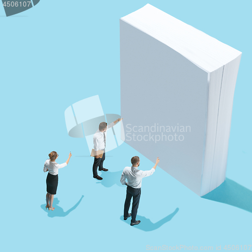 Image of Flat isometric view of businessmen and woman showing at blank sheets of paper with empty copy space