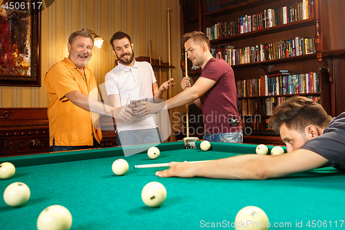 Image of Close-up shot of a man playing billiard