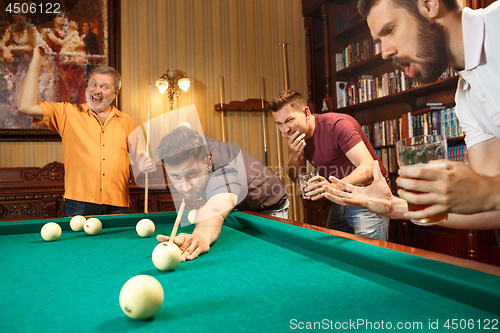 Image of Close-up shot of a man playing billiard