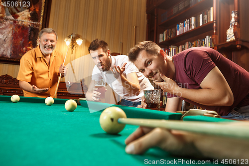 Image of Close-up shot of a man playing billiard