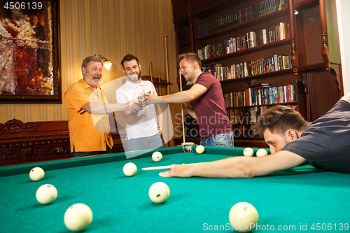 Image of Close-up shot of a man playing billiard