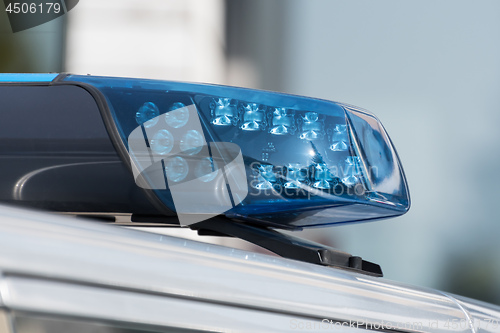 Image of Detail shot of a blue light on a police car