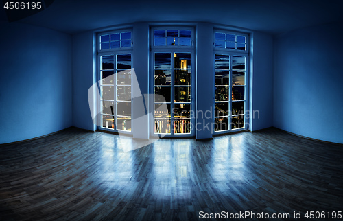 Image of View from an empty apartment to a city at night